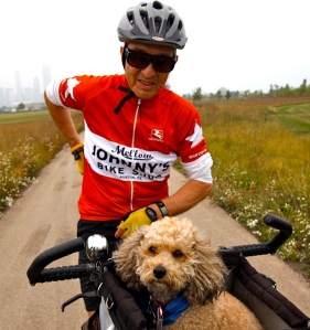 Tony Licata (cq), of Chicago, and his pet poodle Gabi make circuits of the Northery Island bike path Monday, Sept. 21, 2009. (Michael Tercha/Chicago Tribune)